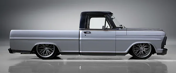 A lowered classic pickup built by Fat Fender Garage, photographed in profile.